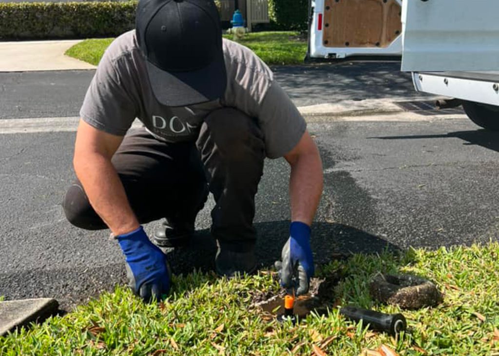 Don Vos employee working on sprinkler
